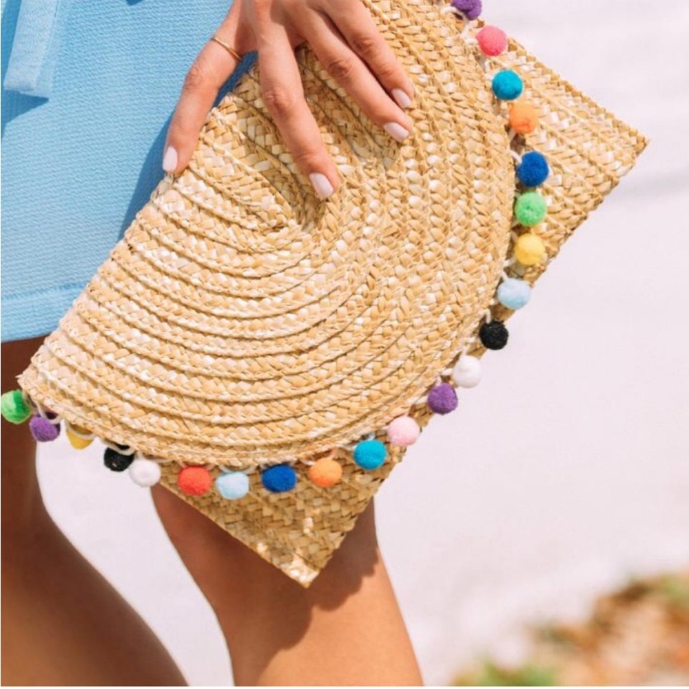Francesca’s Rainbow Pom Pom Straw Clutch
